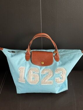 Longchamp Light Blue Tote with Brown Leather Trim and Number Patch